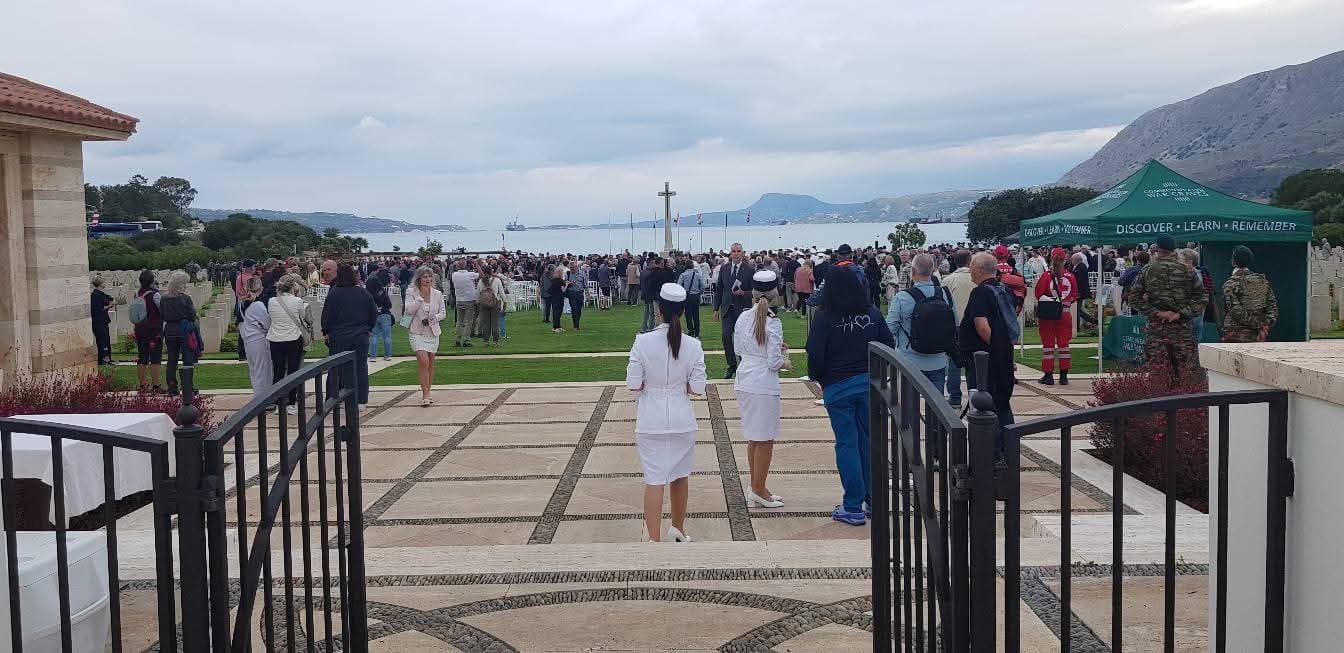 View from the entrance of Souda cemetery towards the Cross of Sacrifice and the bay on commemoration day