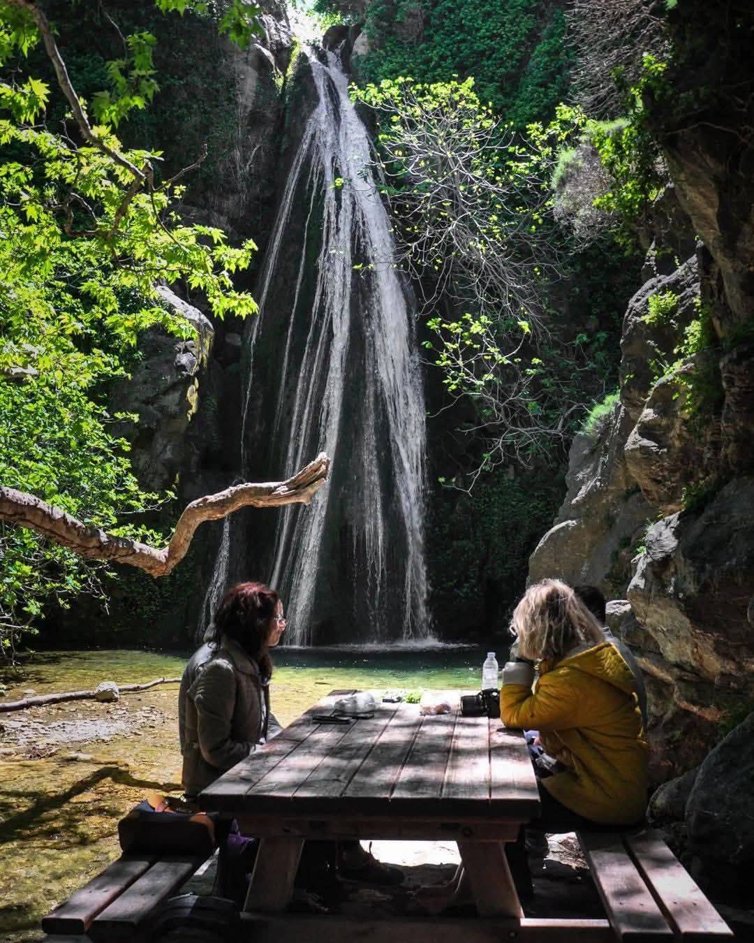 The Richtis waterfall falling into a pool at the bottom of a green gorge, east Crete